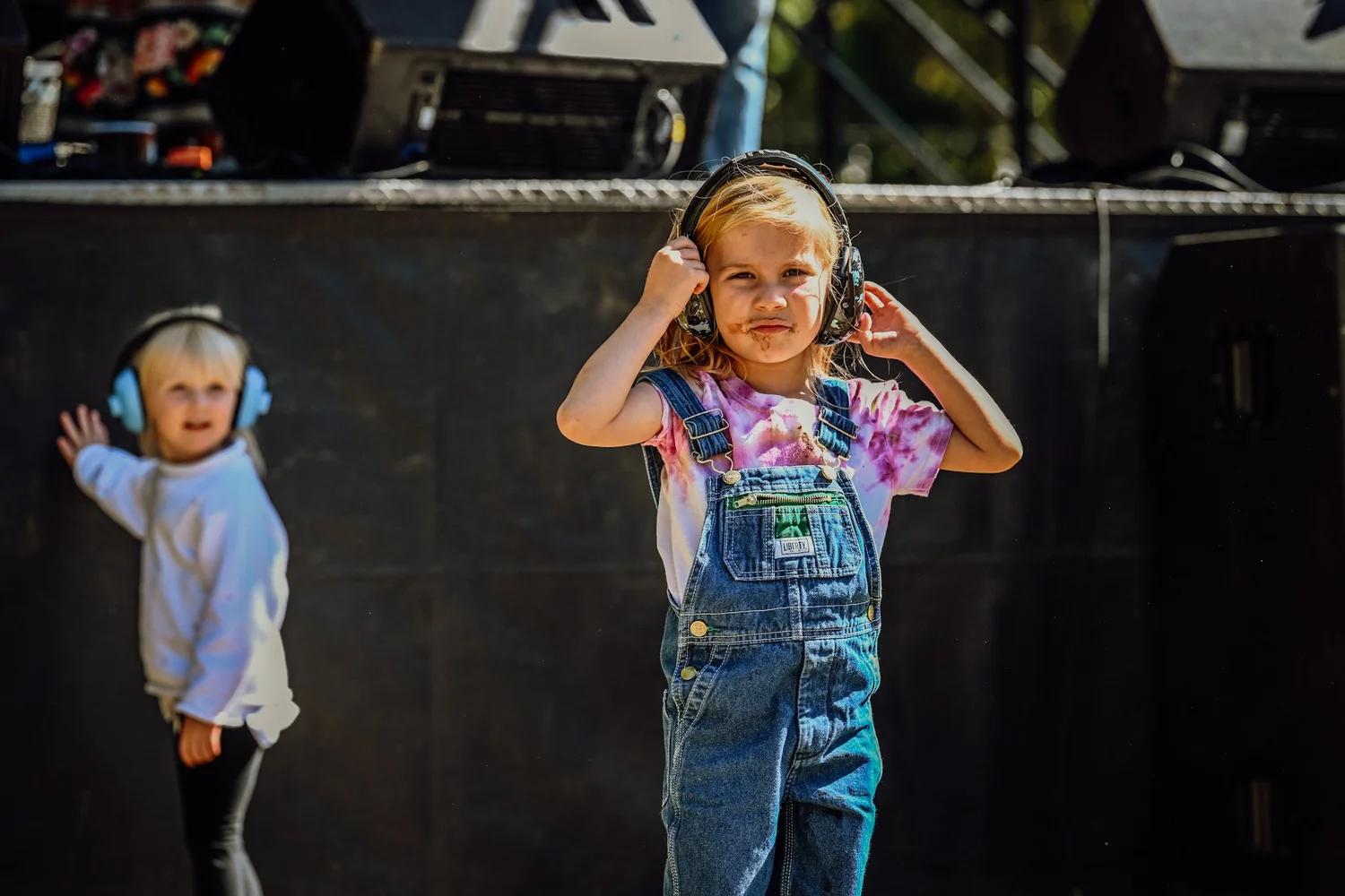 Two little ones in ear protection by the stage at Touch of Brews 2022