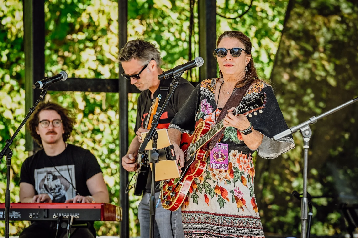 A Touch of Brews 2022 artist performing on stage at Sevier Park