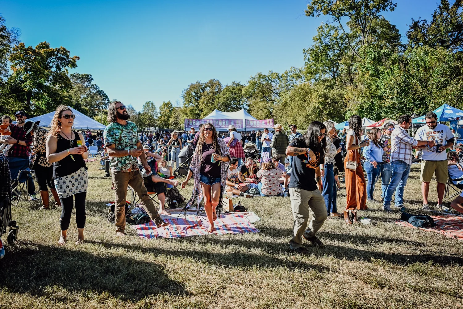 Festival goers dancing on the lawn at Touch of Brews 2022 in 12 South