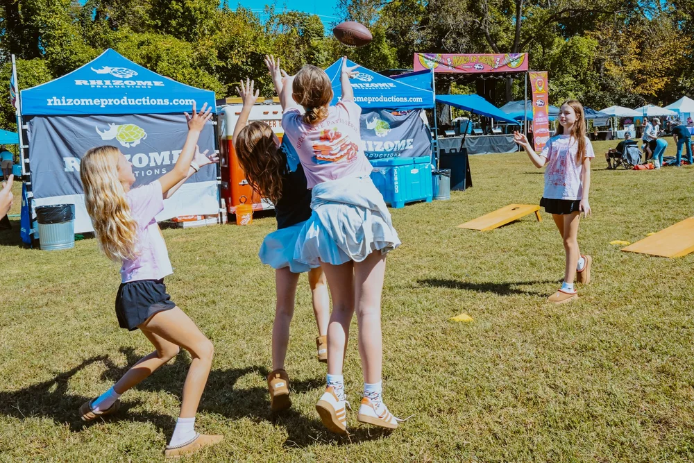 Family dancing together at Touch of Brews 2025