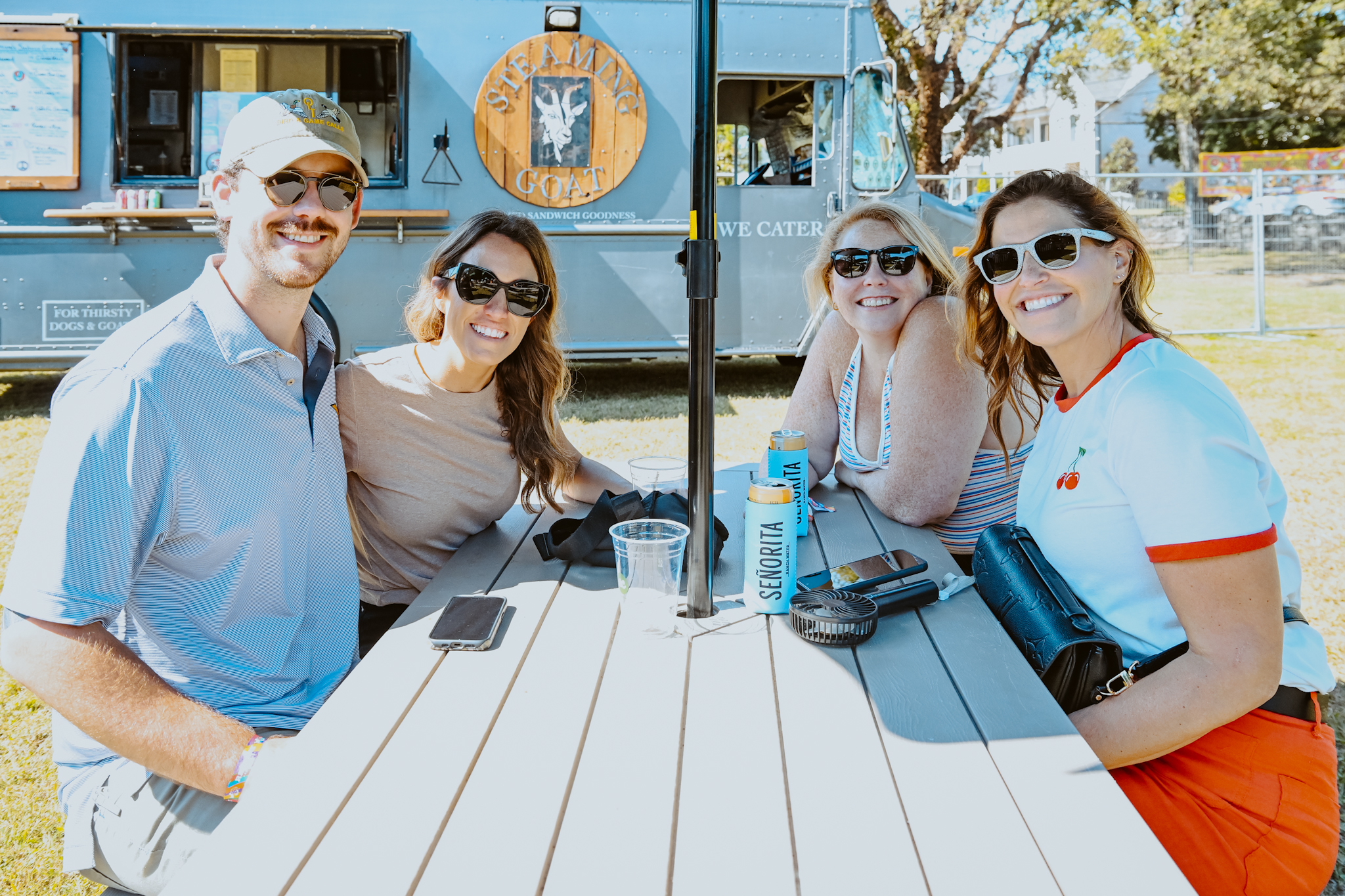 Friends raising a toast at Touch of Brews 2025