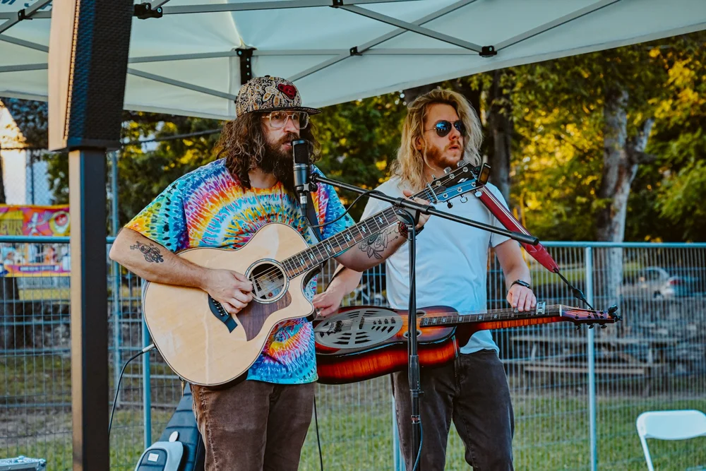 A performer on stage at Touch of Brews