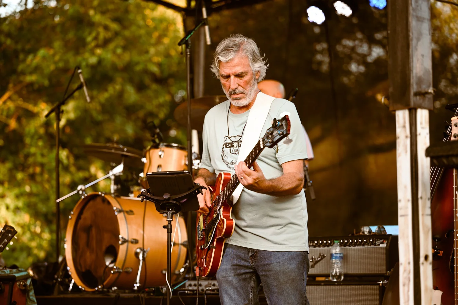 A guitarist performing on the Touch of Brews 2023 stage at Sevier Park