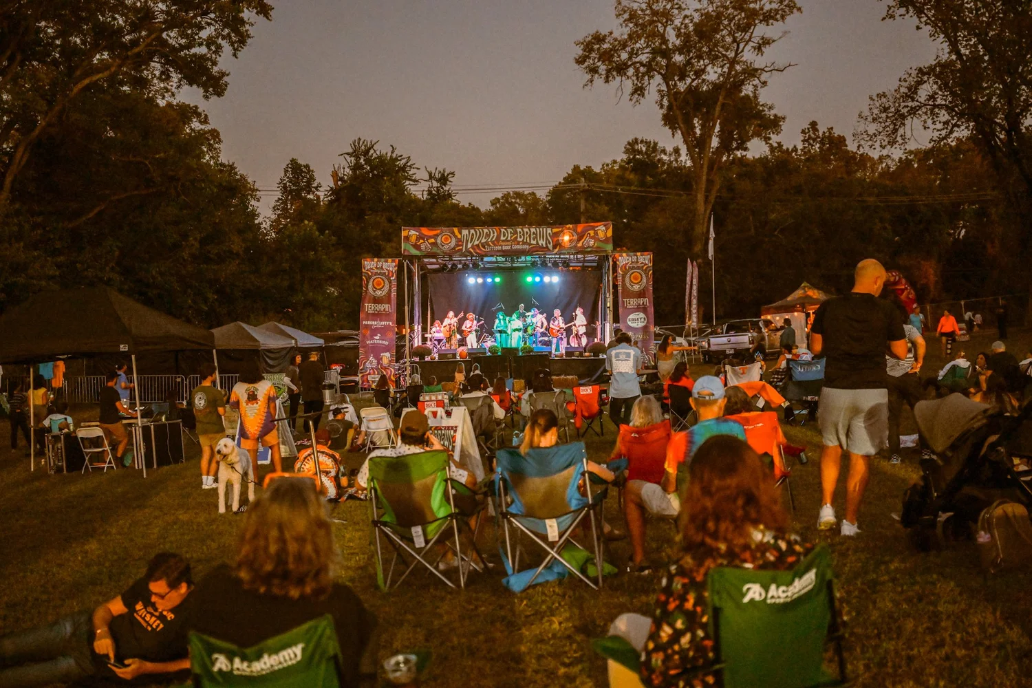 The Touch of Brews 2023 stage lit up at night at Sevier Park