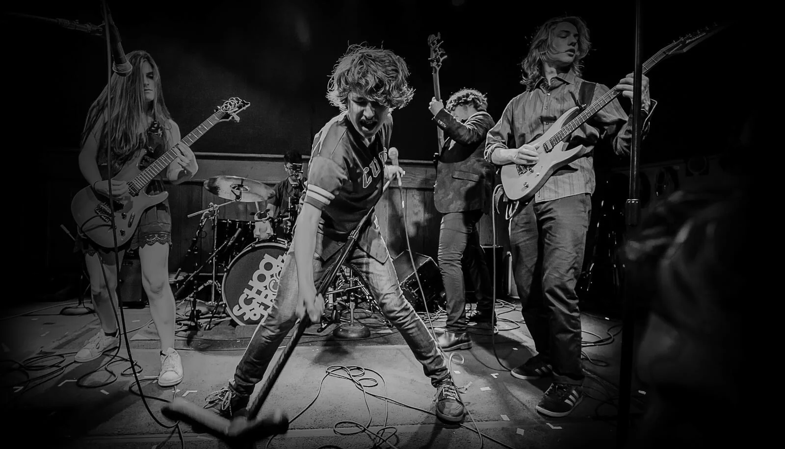 School of Rock students performing live, opening Touch of Brews 2026